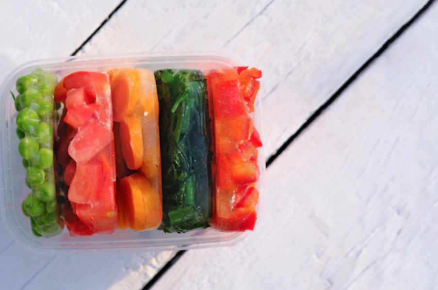 high-angle shot of a container with frozen veggies