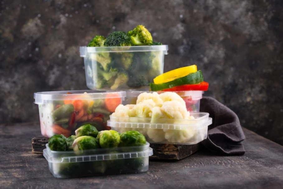 portrait of many Tupperware containers with veggies